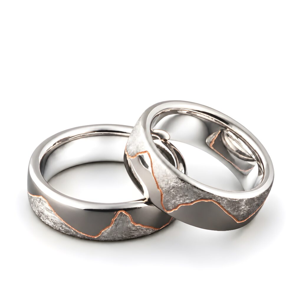 Partnerringe und Trauringe aus Weissgold mit rot vergoldetem Bergumriss-Design. Moderne Hochzeitsringe für gleichgeschlechtliche Paare.